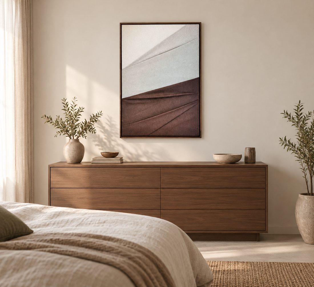 Earth Folds above a walnut dresser in a calm bedroom